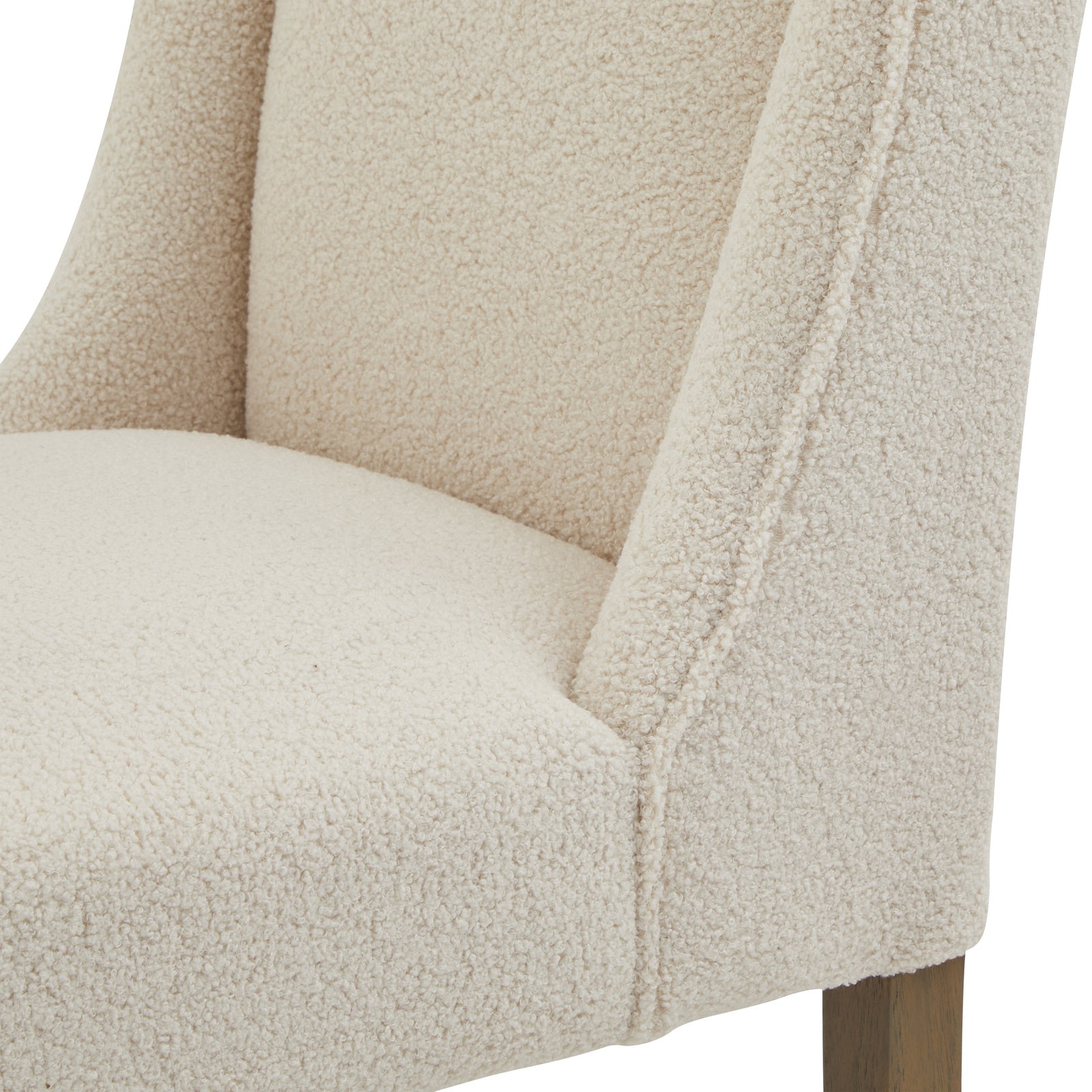Lifestyle view of Hill Interiors Compton boucle dining chair in a stylish contemporary dining space with natural light