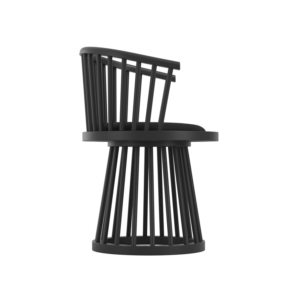 LPD Furniture Lina black velvet dining chair with curved spindle back and black satin wood frame in a modern dining setting