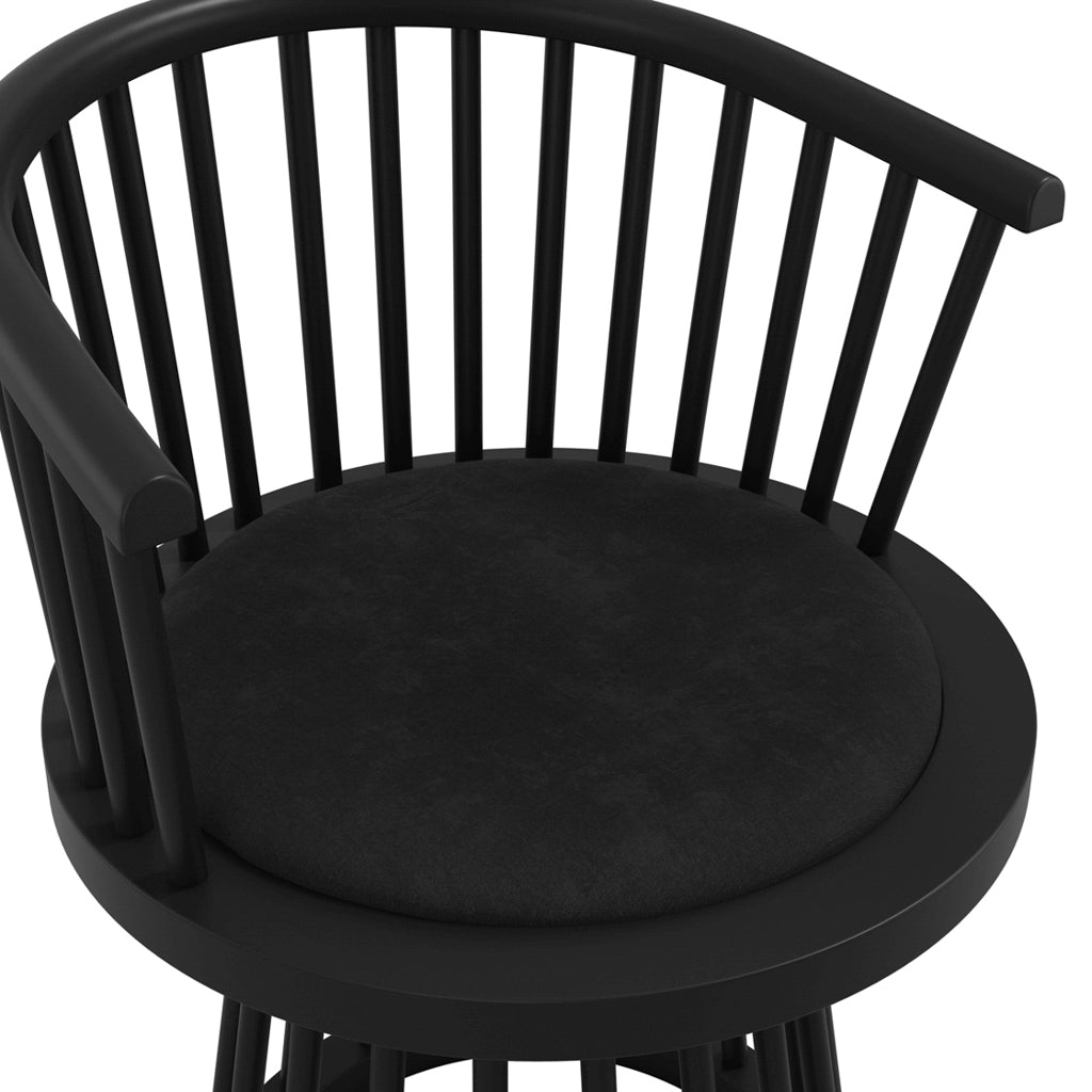 LPD Furniture Lina black velvet dining chair with curved spindle back and black satin wood frame in a modern dining setting