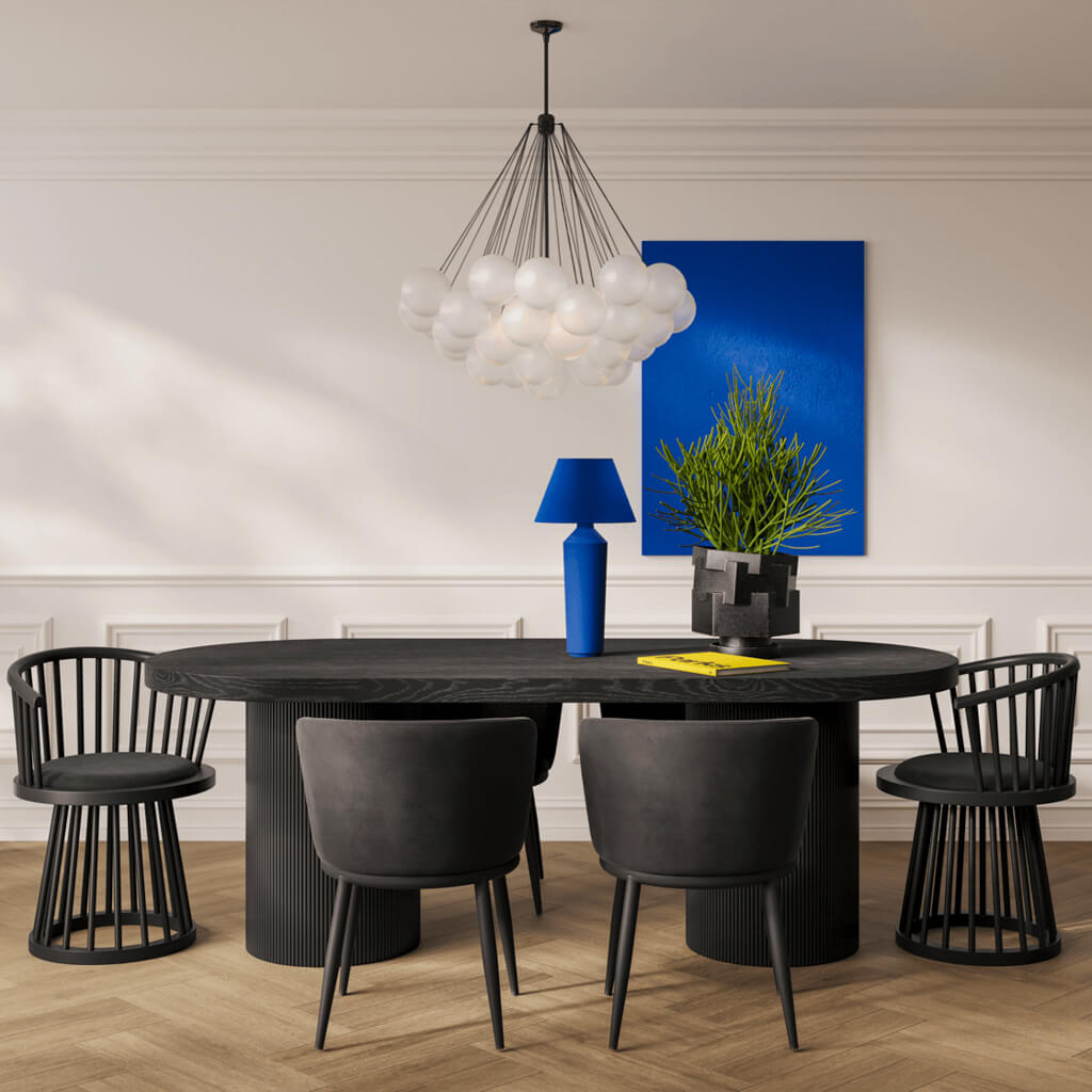 LPD Furniture Lina black velvet dining chair with curved spindle back and black satin wood frame in a modern dining setting