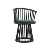 LPD Furniture Lina forest green velvet dining chair with curved spindle back and black satin wood frame in a modern dining setting
