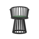 LPD Furniture Lina forest green velvet dining chair with curved spindle back and black satin wood frame in a modern dining setting