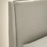 Maddock beige ottoman storage bed with split-panel headboard in a modern bedroom setting