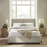 Maddock beige ottoman storage bed with split-panel headboard in a modern bedroom setting