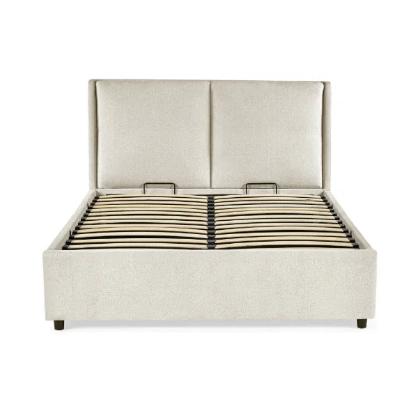 Maddock beige ottoman storage bed with split-panel headboard in a modern bedroom setting