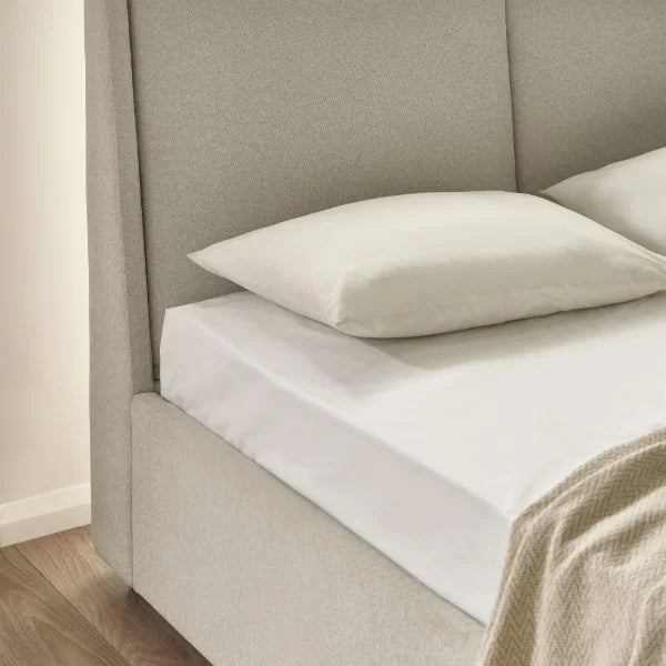 	Maddock beige ottoman storage king bed with split-panel headboard in a modern bedroom setting