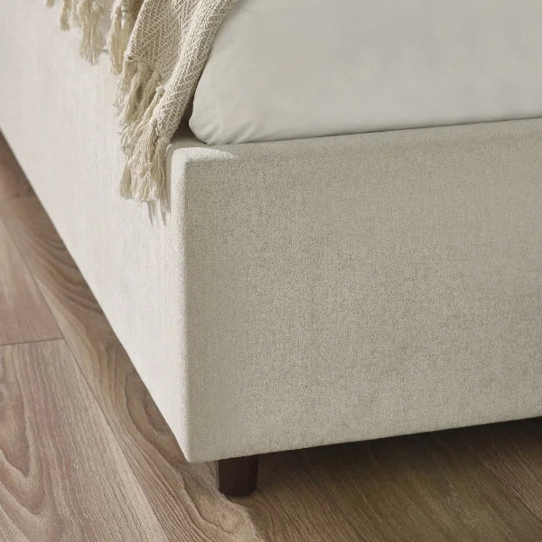 	Maddock beige ottoman storage king bed with split-panel headboard in a modern bedroom setting