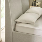 	Maddock beige ottoman storage king bed with split-panel headboard in a modern bedroom setting