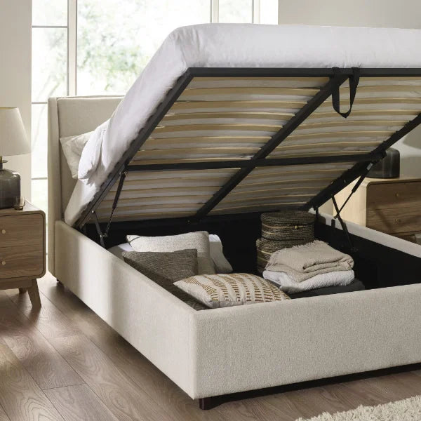 	Maddock beige ottoman storage king bed with split-panel headboard in a modern bedroom setting