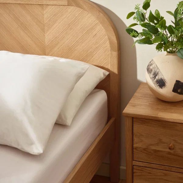 Milo chevron oak king bed with statement chevron headboard in a modern bedroom setting