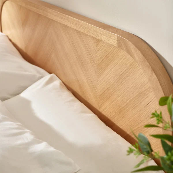 Milo chevron oak king bed with statement chevron headboard in a modern bedroom setting