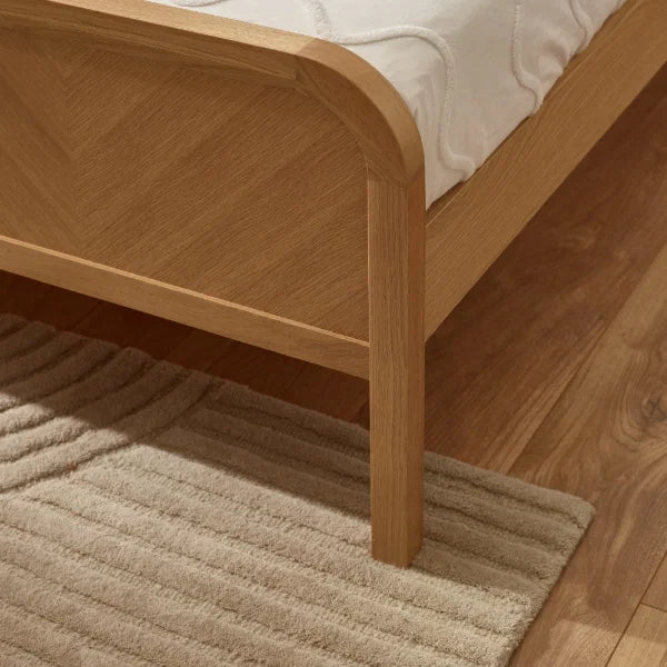 Milo chevron oak king bed with statement chevron headboard in a modern bedroom setting