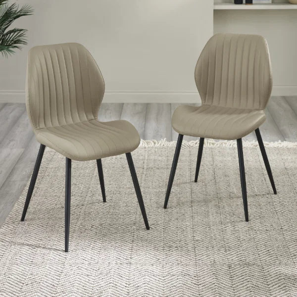 Morris set of 4 taupe faux leather dining chairs in a modern dining room setting