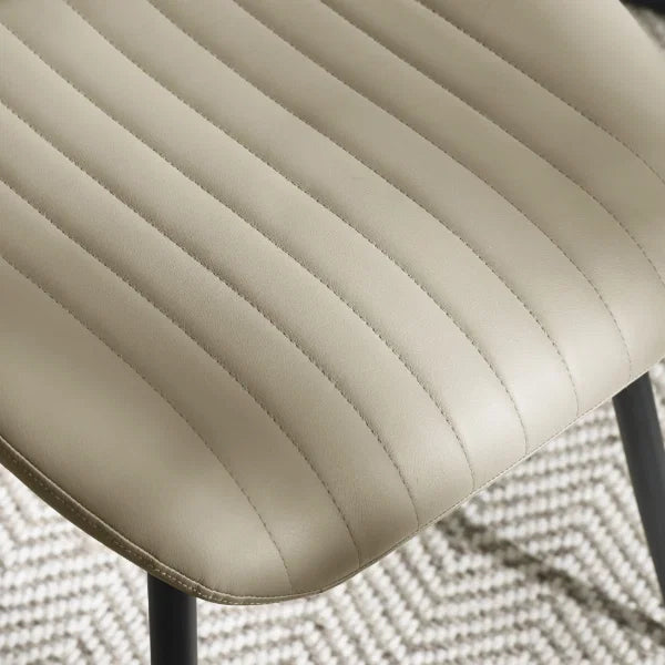 Morris set of 4 taupe faux leather dining chairs in a modern dining room setting