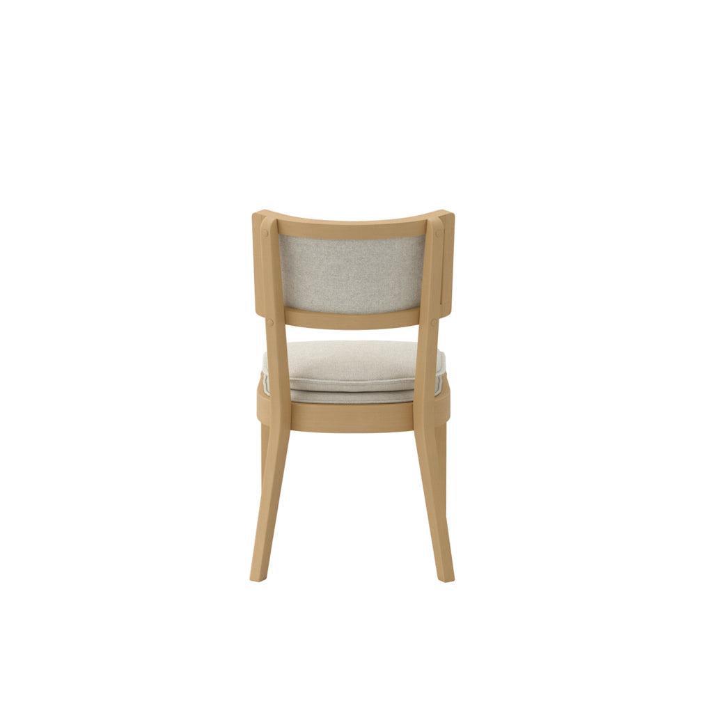 LPD Furniture Maggie frost woven fabric dining chair with umber wood frame in a modern dining setting
