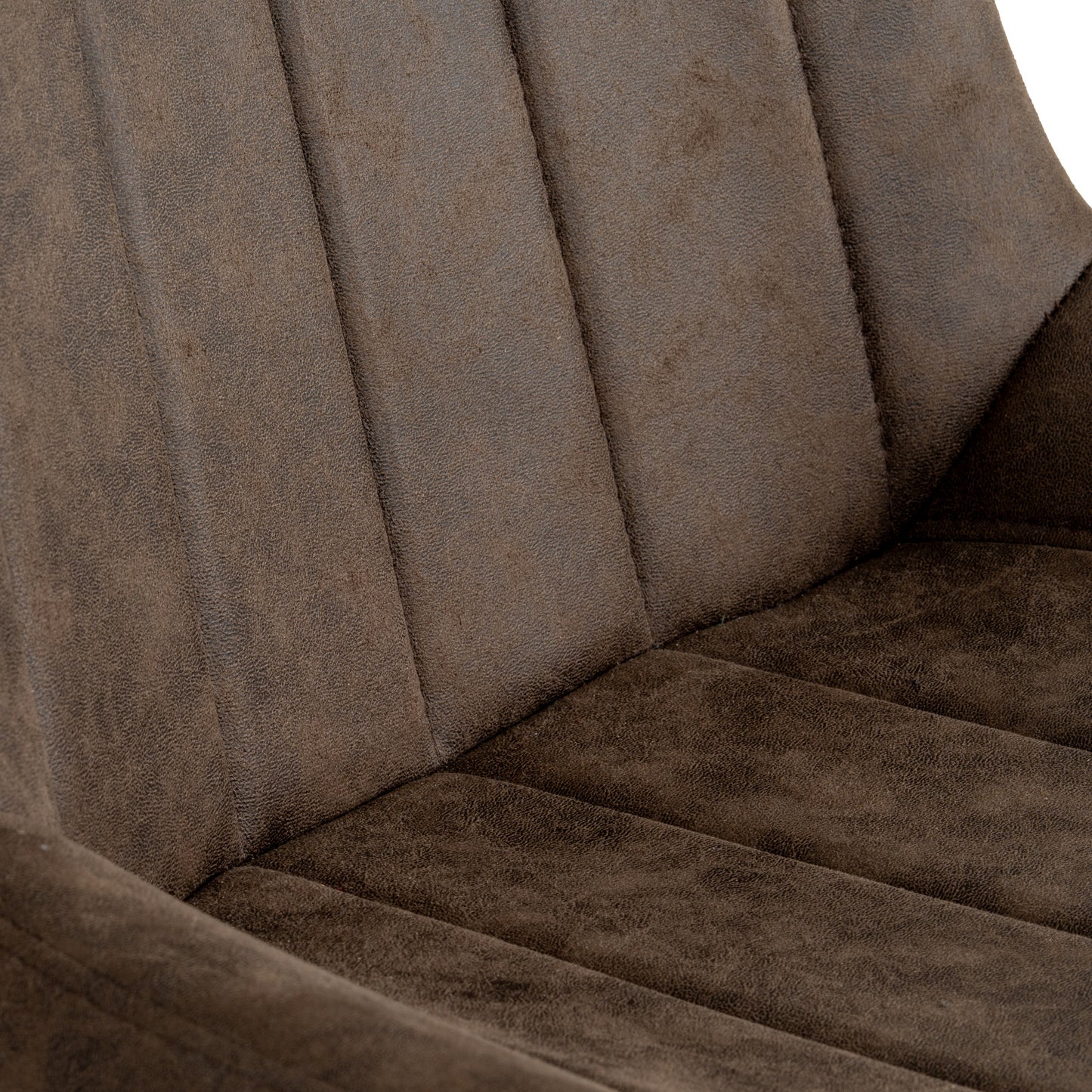 Malmo coffee dining chair in a dining room setting with wooden table and natural lighting