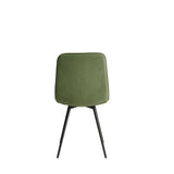 LPD Furniture Maxi moss green corduroy dining chair with black metal legs in a modern dining setting