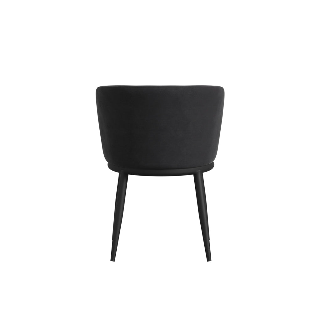 LPD Furniture Nova black velvet dining chair with angular metal legs in a modern dining setting