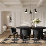 LPD Furniture Nova black velvet dining chair with angular metal legs in a modern dining setting