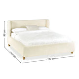 Oberon cream bouclé upholstered bed with curved padded headboard in a modern bedroom setting