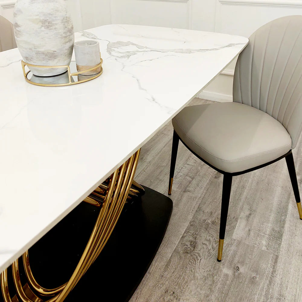 Furnish365 Orion gold and black dining table with polar white sintered stone top in a contemporary dining room setting