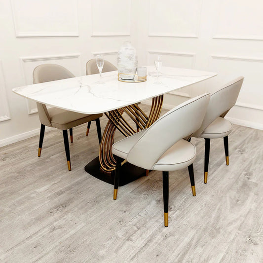 Furnish365 Orion gold and black dining table with polar white sintered stone top in a contemporary dining room setting