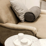 LPD Furniture Plumpton beige velvet armchair with wide cushioned seat in a modern living room setting