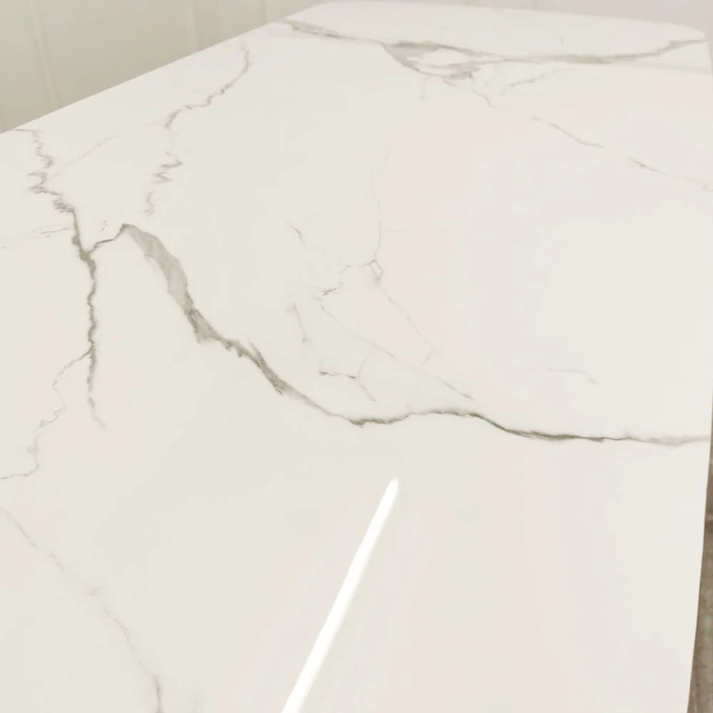 Furnish365 Orion gold and black dining table with polar white sintered stone top in a contemporary dining room setting