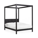 Roxanne black canopy bed with tall open four-poster frame in a modern bedroom setting