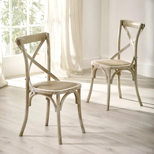 Satie set of 2 bistro dining chairs with cross-back design and woven seat in a modern dining setting