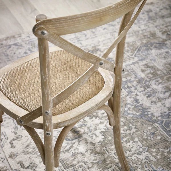 Satie set of 2 bistro dining chairs with cross-back design and woven seat in a modern dining setting
