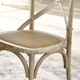 Satie set of 2 bistro dining chairs with cross-back design and woven seat in a modern dining setting