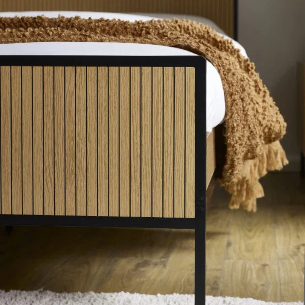 Sia grey upholstered bed frame with textured fabric finish in a modern bedroom setting