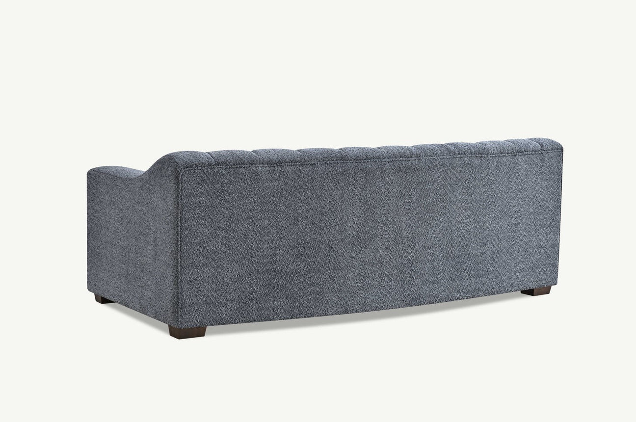 Furnish365 Astoria iron bouclé 3 seater sofa with deep channel stitching in a modern living room setting