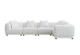 	Furnish365 Lottie modular bouclé corner sofa with scatter cushions in a modern living room setting