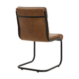Side view of Hill Interiors Billy leather dining chair showing the sleek black metal frame and caramel upholstery