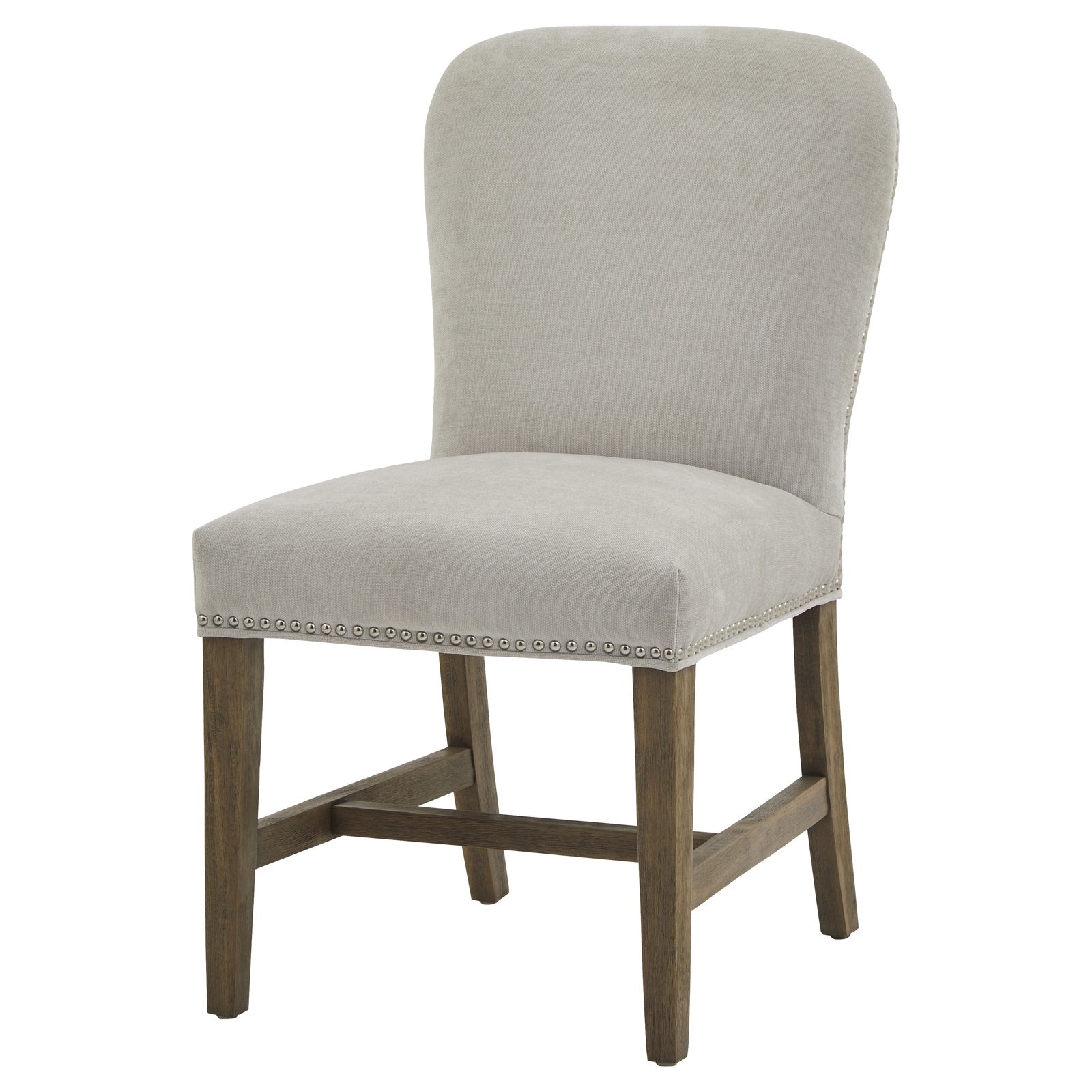 	Side view of Hill Interiors Cobham grey dining chair showing curved backrest and antique brass stud details