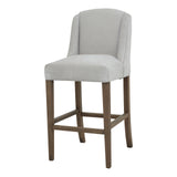 Side view of Hill Interiors Compton grey barstool showing the fabric upholstery and wooden frame