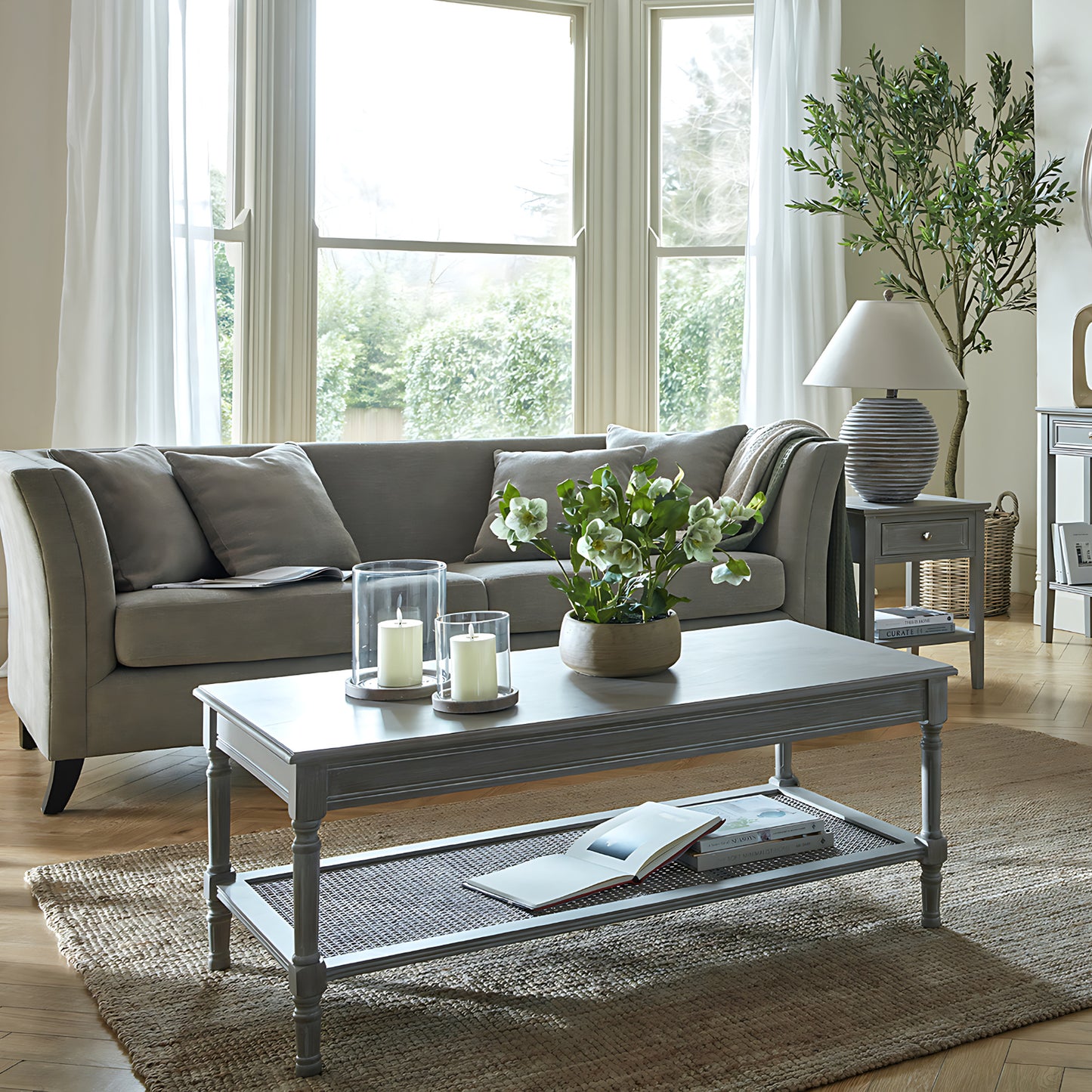 Side view of Hill Interiors Serene Rattan coffee table showing the rattan texture and wooden frame