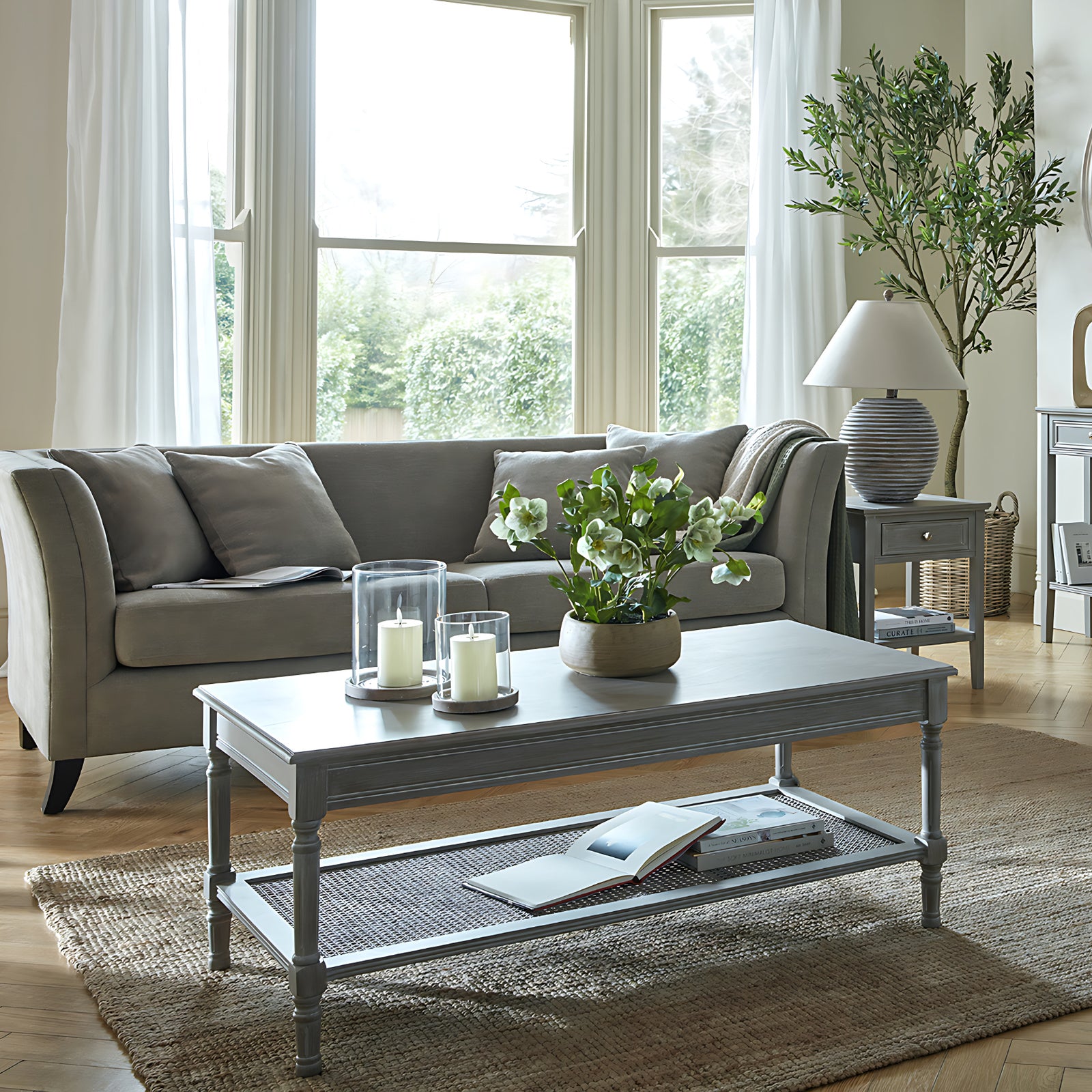 Side view of Hill Interiors Serene Rattan coffee table showing the rattan texture and wooden frame