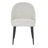 Hill Interiors Sorelle white fabric dining chair with metal frame, placed in a contemporary dining setting