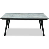 Side view of Hill Interiors Stellen rectangular dining table showing the wooden top and metal base