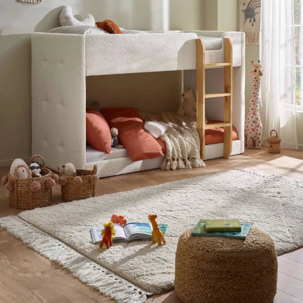 Teddy cream bouclé bunk bed with natural wood ladder in a modern kids bedroom setting