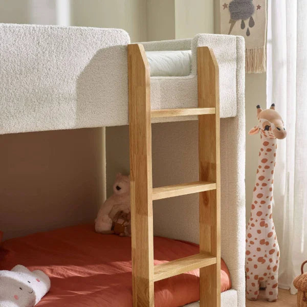 Teddy cream bouclé bunk bed with natural wood ladder in a modern kids bedroom setting