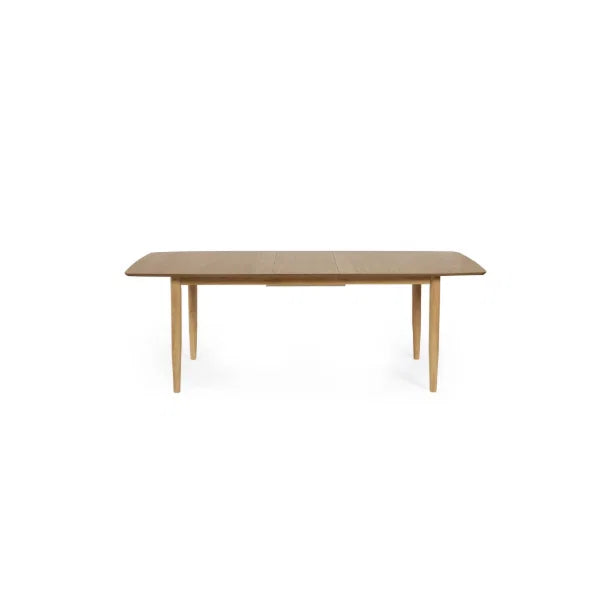 Theia oak extending dining table in a modern dining room setting