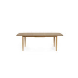 Theia oak extending dining table in a modern dining room setting