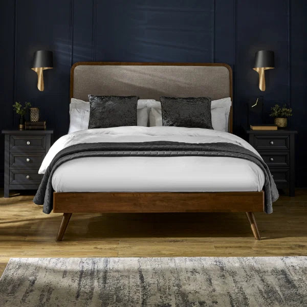 Walden walnut king bed with grey chenille headboard in a modern bedroom setting