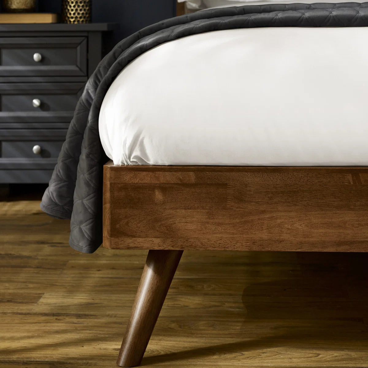Walden walnut king bed with grey chenille headboard in a modern bedroom setting