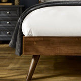 Walden walnut king bed with grey chenille headboard in a modern bedroom setting