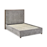Whitmore upholstered double bed with vertical stitched headboard and walnut frame in a modern bedroom setting
